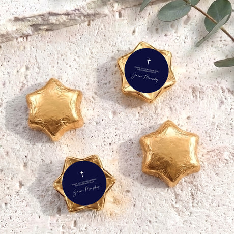 Gold foil star chocolates with dark blue round label featuring cross and message