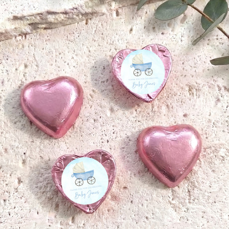 Pink foil heart chocolates with baby carriage design, set of four