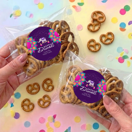 Diwali pretzel bag with purple elephant sticker label and pretzels in clear wrap