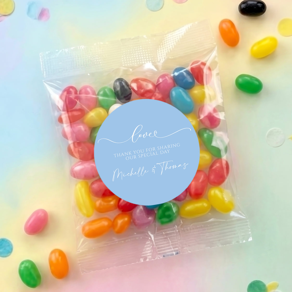 Personalized jelly bean bag with blue Love label and multicolor beans in clear pouch