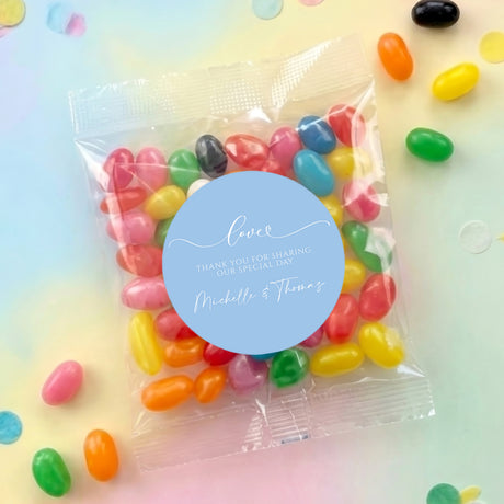 Personalized jelly bean bag with blue Love label and multicolor beans in clear pouch