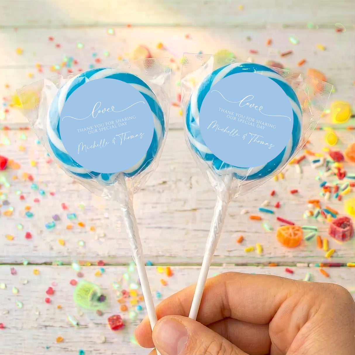 Personalised baby blue wedding lollipops with round love message labels, two sticks