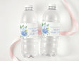 Personalised water bottle labels on two clear plastic bottles with blue floral design