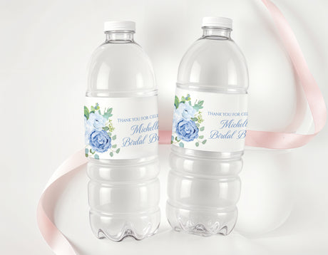 Personalised water bottle labels on two clear plastic bottles with blue floral design