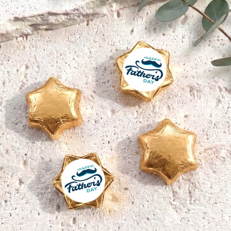 Foil-covered chocolate stars, golden foil with Happy Father’s Day label star