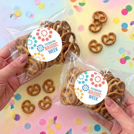 Personalised pastel dot pretzel snack bag with round NAIDOC WEEK label