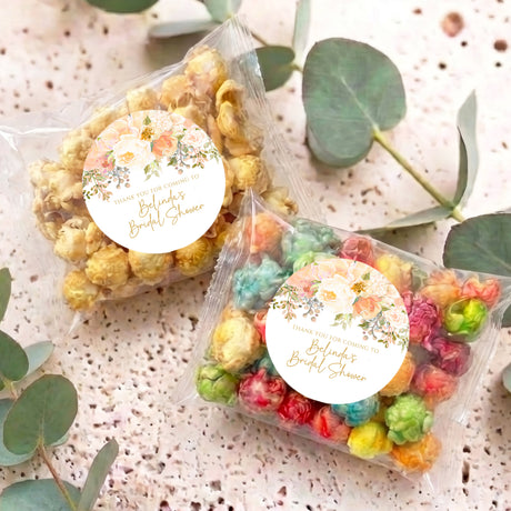 Personalised popcorn bags with floral round label, clear crinkle wrap, assorted pastel popcorn