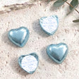 Blue foil-covered chocolate hearts with heart-shaped foil wrap and white label