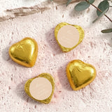 Gold foil-covered chocolate hearts with beige round labels and heart shapes