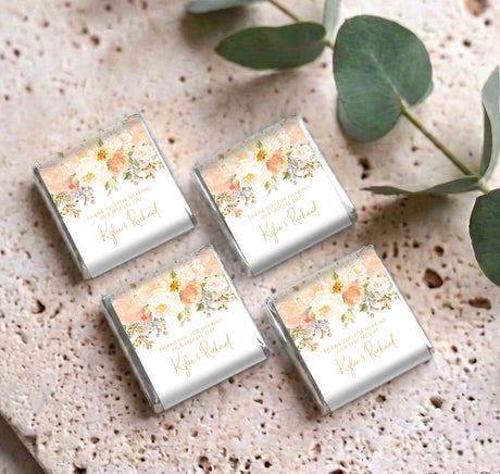 Set of four mini chocolates with peach-rose floral wrappers and personalized names