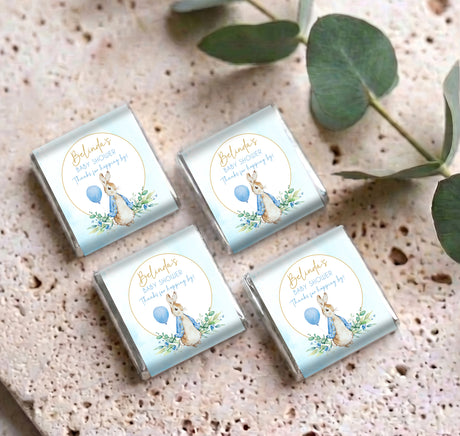 Four Blue Peter Rabbit mini chocolates with Belinda labels, rabbit and blue balloon on wrappers