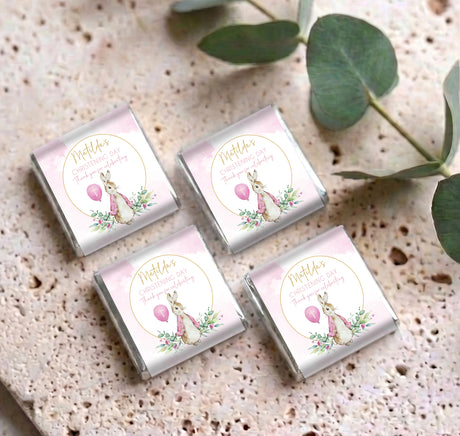 Set of pink christening mini chocolates with bunny and balloon labels, silver wrappers