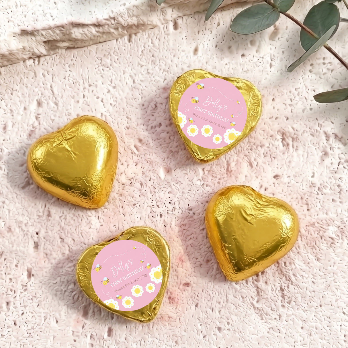 Foil-covered gold chocolate heart chocolates with birthday labels, four foil hearts shown