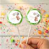 Personalised baby lollipops with green-rim bear label on clear wrapped sticks