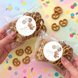 Personalised baby pretzel snack bags with clear plastic, pretzels, and round 'ONE' bear labels