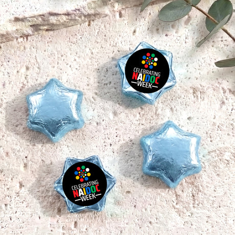 Foil-covered chocolate stars with Naidoc Week label, blue foil