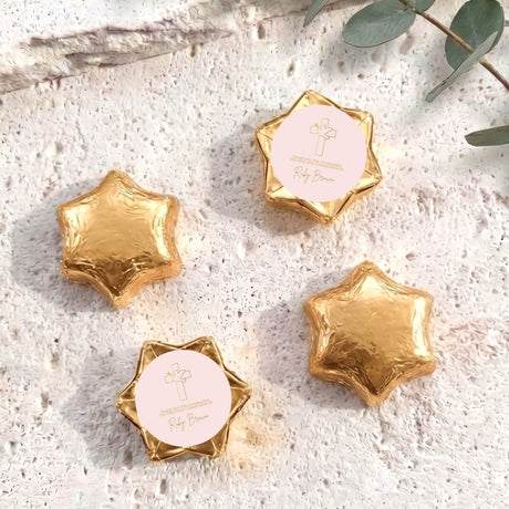 Gold foil chocolate stars with round personalised label and small cross emblem