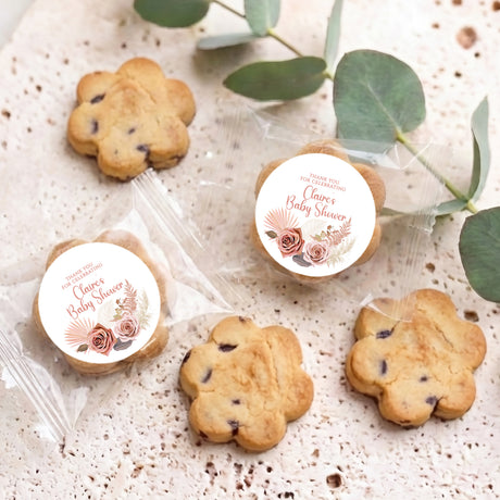 Mini chocolate chip cookies in clear bags with circular Baby Shower thank-you labels