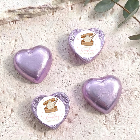 Purple foil-covered chocolate hearts with white personalised stickers