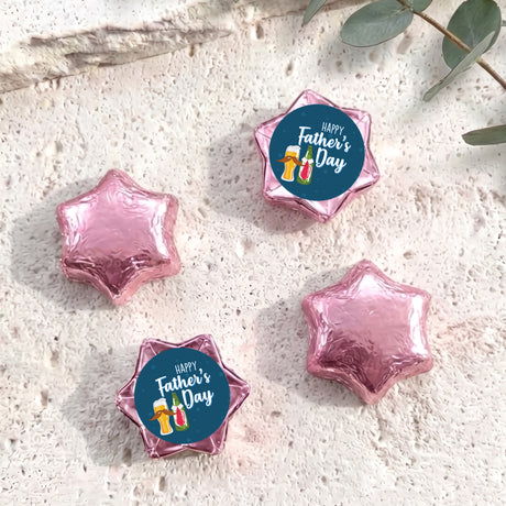 Pink foil-covered chocolate stars with a blue Happy Father’s Day chocolate label