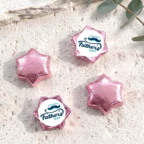 Foil-covered chocolate stars, pink foil with Happy Father’s Day label star