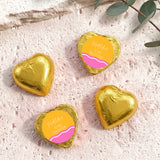 Gold foil-covered chocolate heart chocolates with personalised birthday label on top