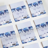 Blue floral printed chocolate wrapper set with script name and barcode labels