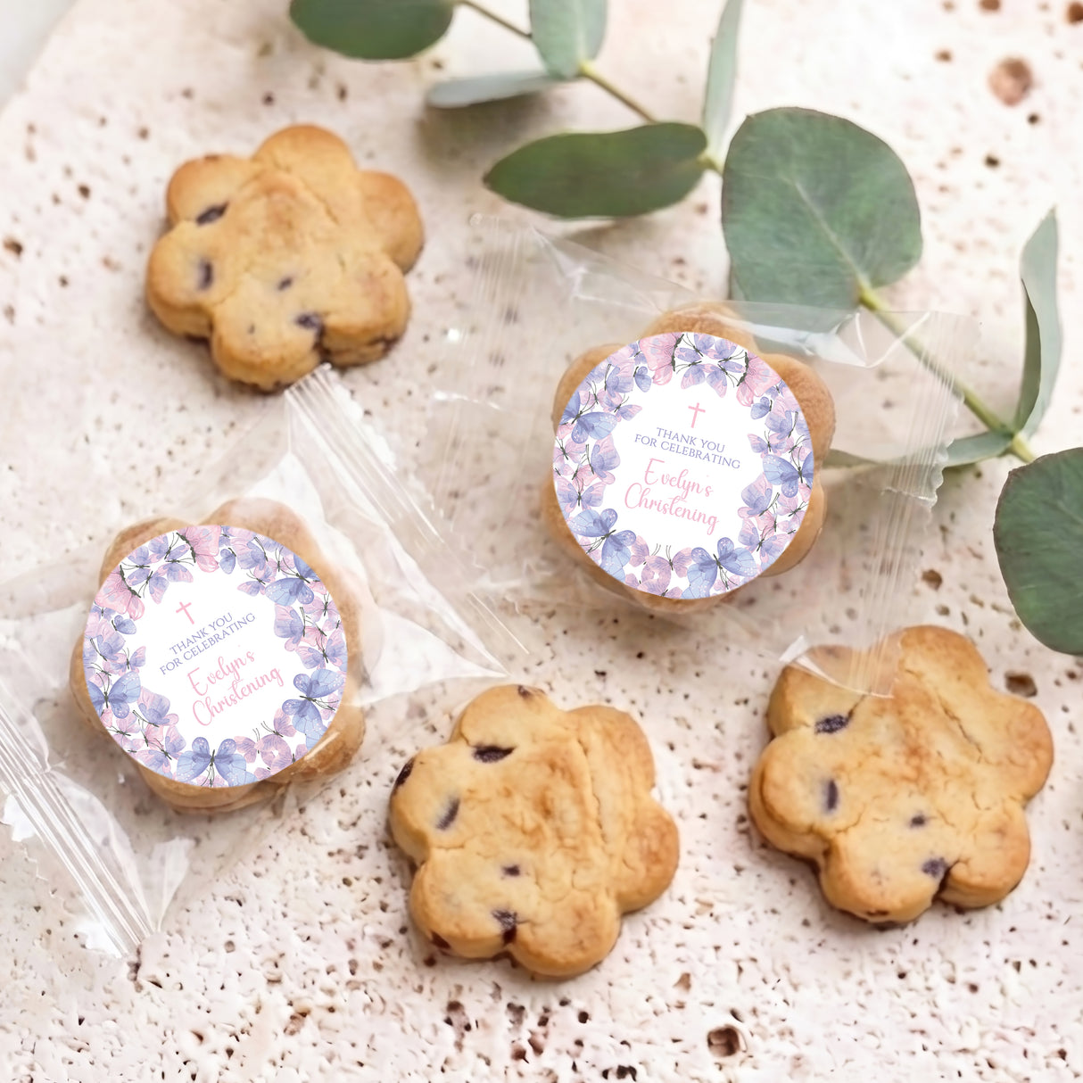 Assorted butter cookies in clear bags, each with purple butterfly round “Thank you” label
