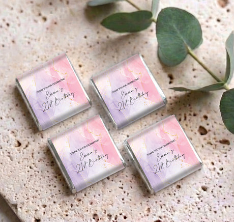 Set of four personalised mini chocolate bars with pink purple marble birthday wrappers
