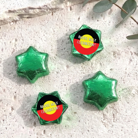 Foil-covered chocolate stars, green with Naidoc Week Celebrations label