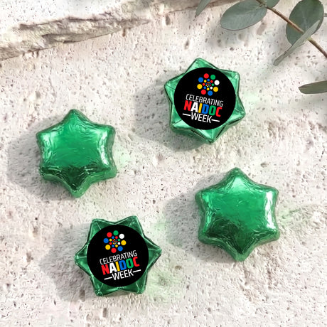 Foil-covered chocolate stars with Naidoc Week label, green foil