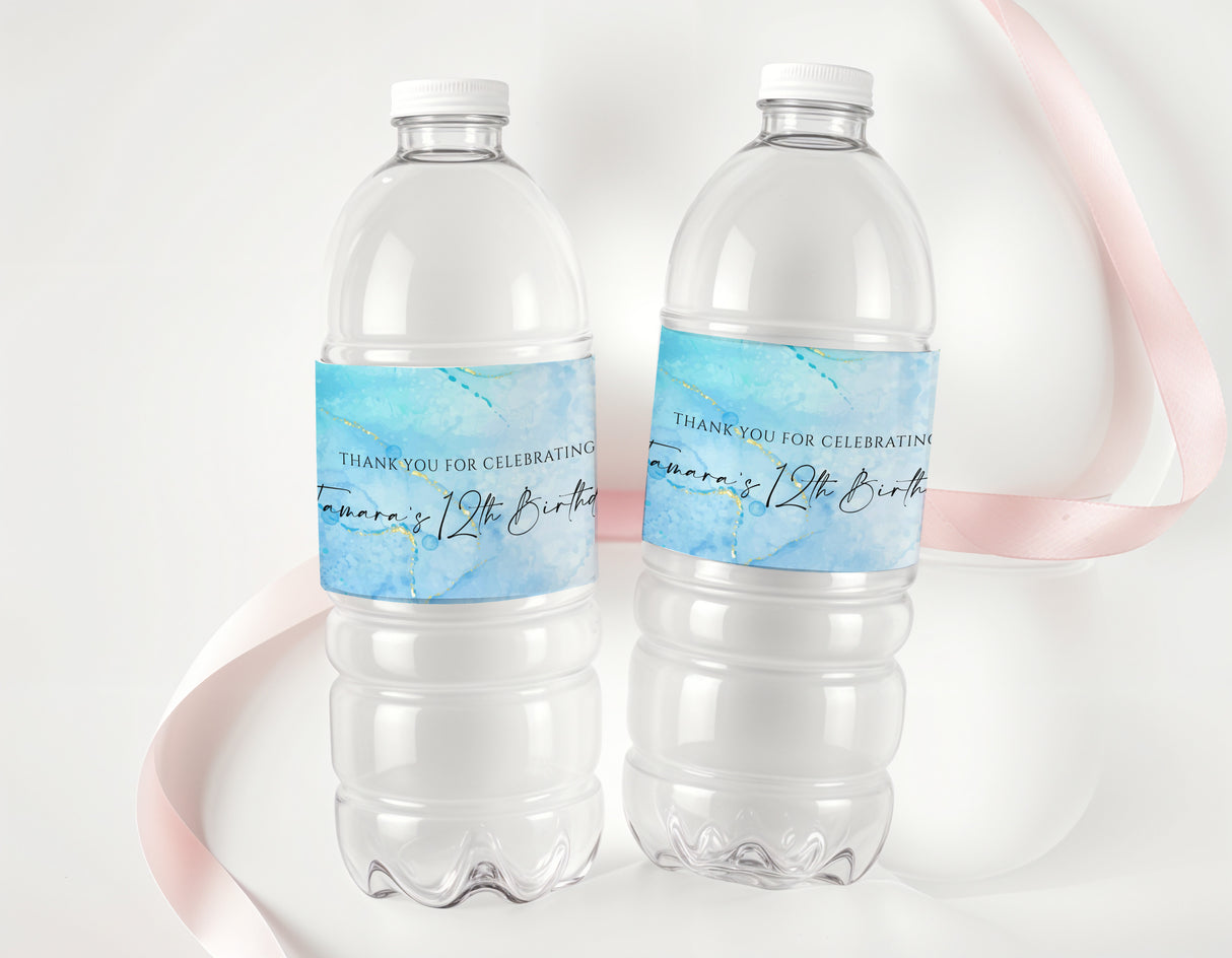 Personalised drink bottle labels for a 12th birthday, blue text on clear bottles