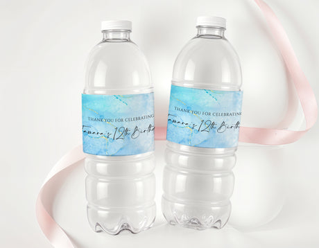 Personalised drink bottle labels for a 12th birthday, blue text on clear bottles