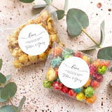 Set of two personalised popcorn gift bags with Love label and clear wrappers.
