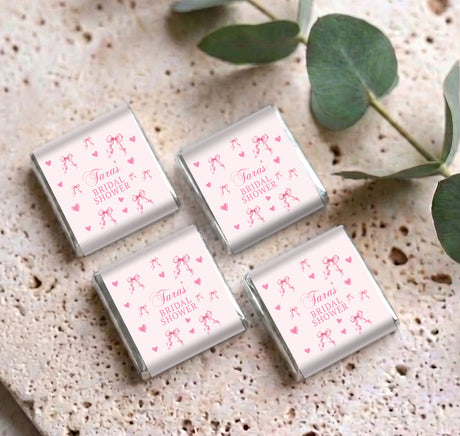 Set of four mini bridal shower chocolate boxes, pink bows and hearts on white labels