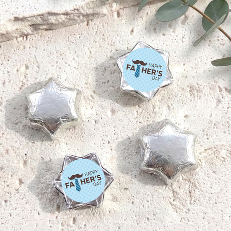 Foil-covered chocolate stars in silver with Happy Father's Day foil label
