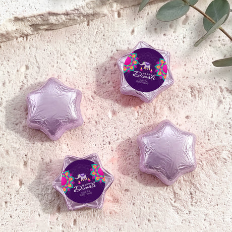 Purple foil-covered chocolate stars in star shapes with Diwali elephant label.