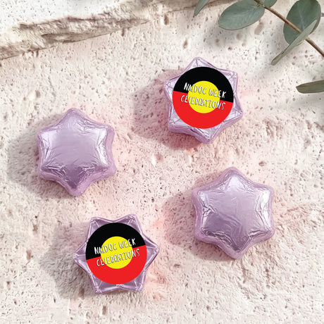 Foil-covered chocolate stars, light purple with Naidoc Week Celebrations label