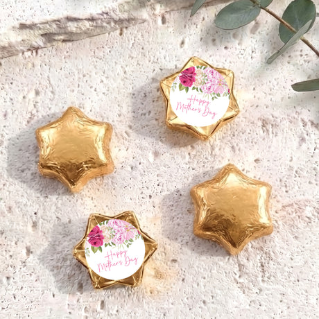 Foil-covered gold chocolate stars, one with floral 'Happy Mother's Day' label