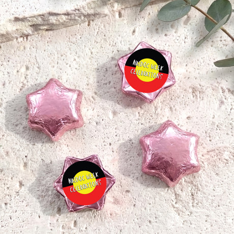 Foil-covered chocolate stars, pink with Naidoc Week Celebrations label