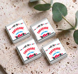 Four racing mini chocolate wrappers with THE ODORE and Two Fast text, car and checkered pattern