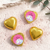 Gold foil chocolate hearts with unicorn “Zara’s 6th Birthday” label.