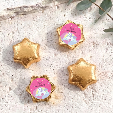 Gold star-shaped foil chocolate with “Zara’s 6th Birthday” unicorn rainbow label