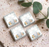Set of four mini chocolate wrappers with safari animals illustration and eucalyptus leaf border
