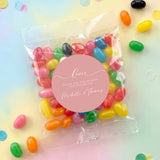 Dusty pink jelly bean bags with clear candy wrappers and round love thank-you labels