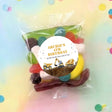 Construction trucks lolly bag with round 'ARCHIE'S 4TH BIRTHDAY' label