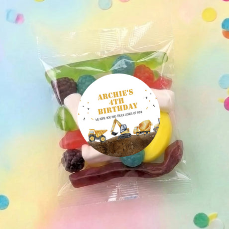 Construction trucks lolly bag with round 'ARCHIE'S 4TH BIRTHDAY' label