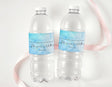 Two clear plastic water bottles with blue ink personalized labels and handwritten names/date
