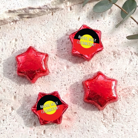 Foil-covered chocolate stars, red with Naidoc Week Celebrations label