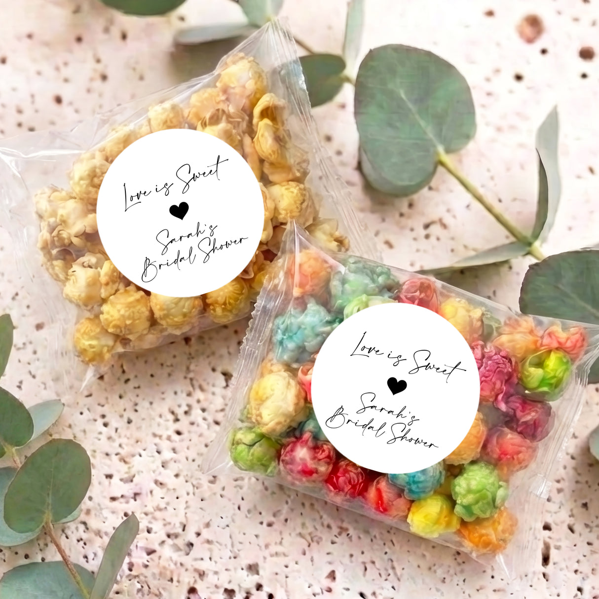 Clear popcorn bags with round white 'Love is sweet' label and heart